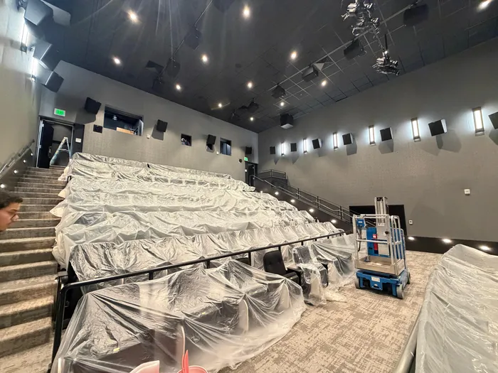 Auditorium seating wrapped for protection during post-construction cleanup