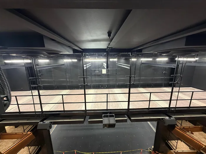 Backstage catwalk and rigging above the stage