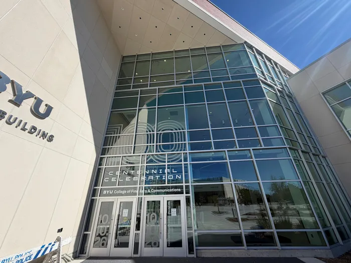 Glass entrance facade of the BYU College of Fine Arts & Communications