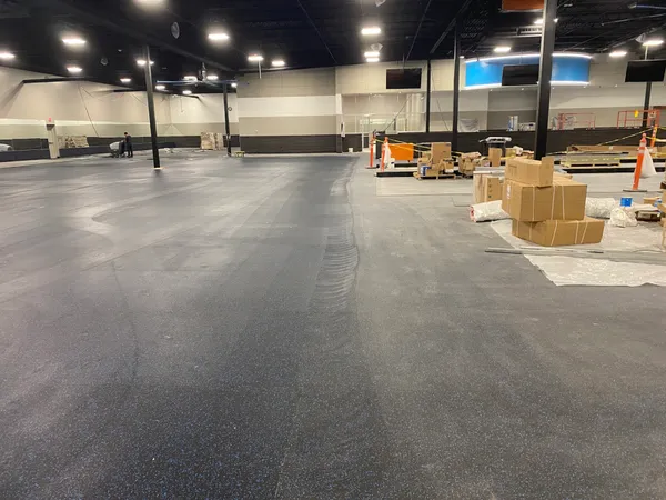 Post-construction floor cleanup at a gym build-out