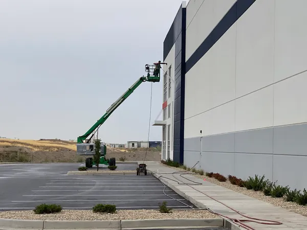 Exterior pressure washing on a commercial building